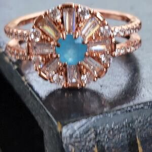 Rose Gold Plated Eternity Ring with Blue Gemstones - Size 10